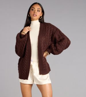 This brown piece brings trend-right energy to the Wrap Me Up Cable Knit Cardigan, perfect for fall outfits that stand out.