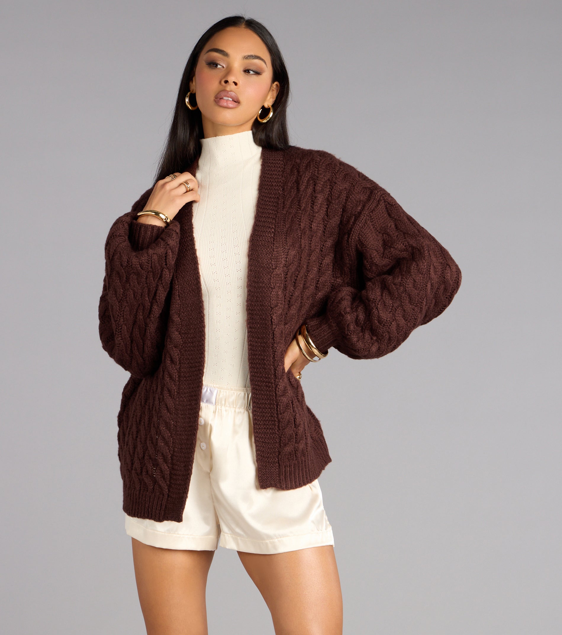 This brown piece brings trend-right energy to the Wrap Me Up Cable Knit Cardigan, perfect for fall outfits that stand out.