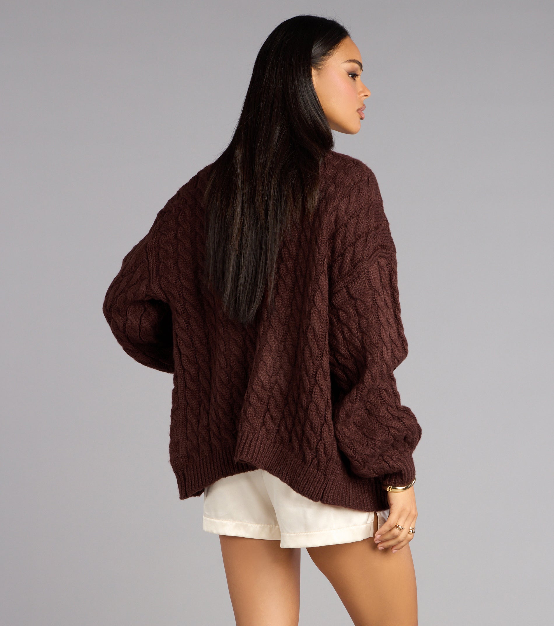 This brown piece brings trend-right energy to the Wrap Me Up Cable Knit Cardigan, perfect for fall outfits that stand out.