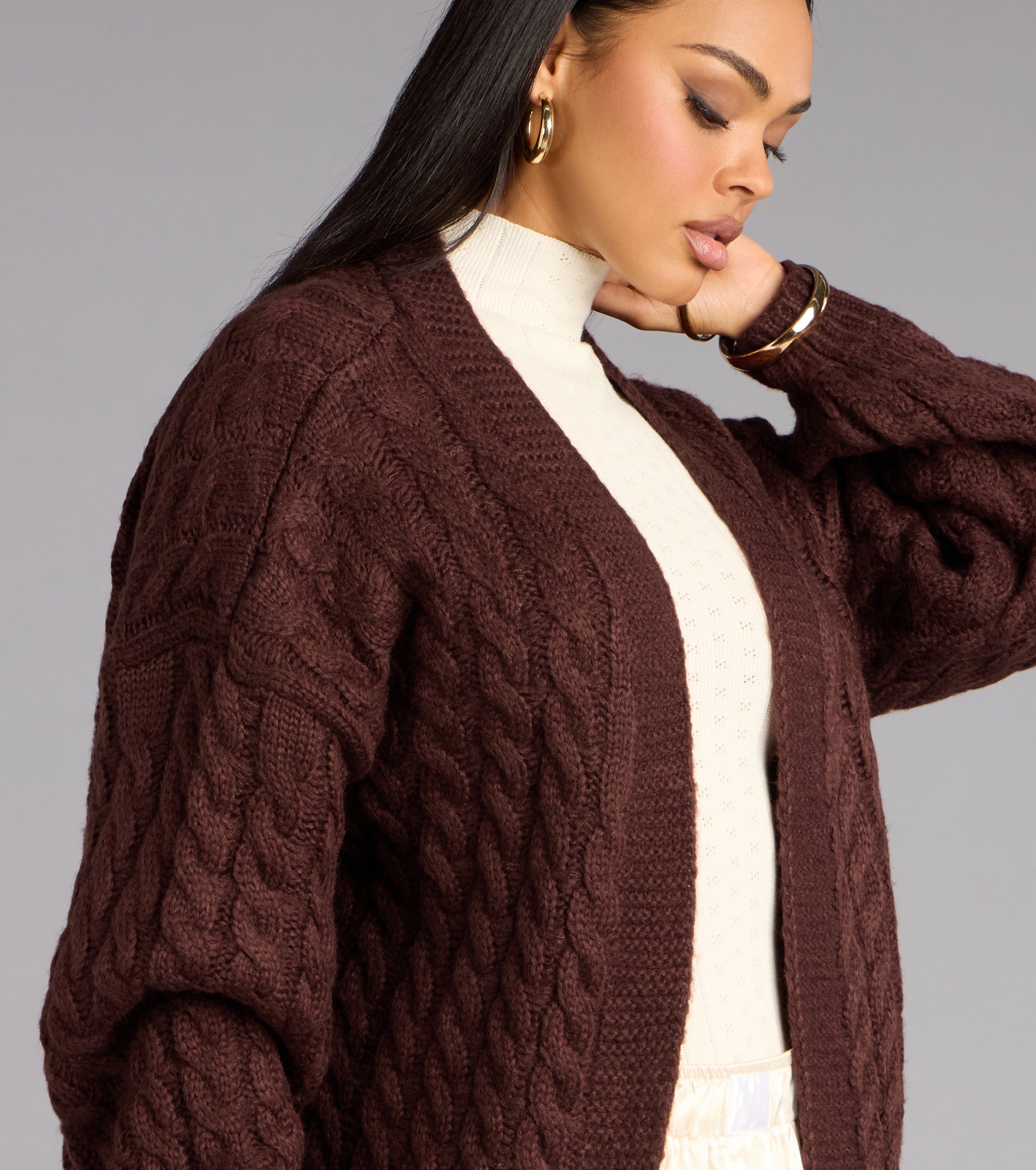 This brown piece brings trend-right energy to the Wrap Me Up Cable Knit Cardigan, perfect for fall outfits that stand out.