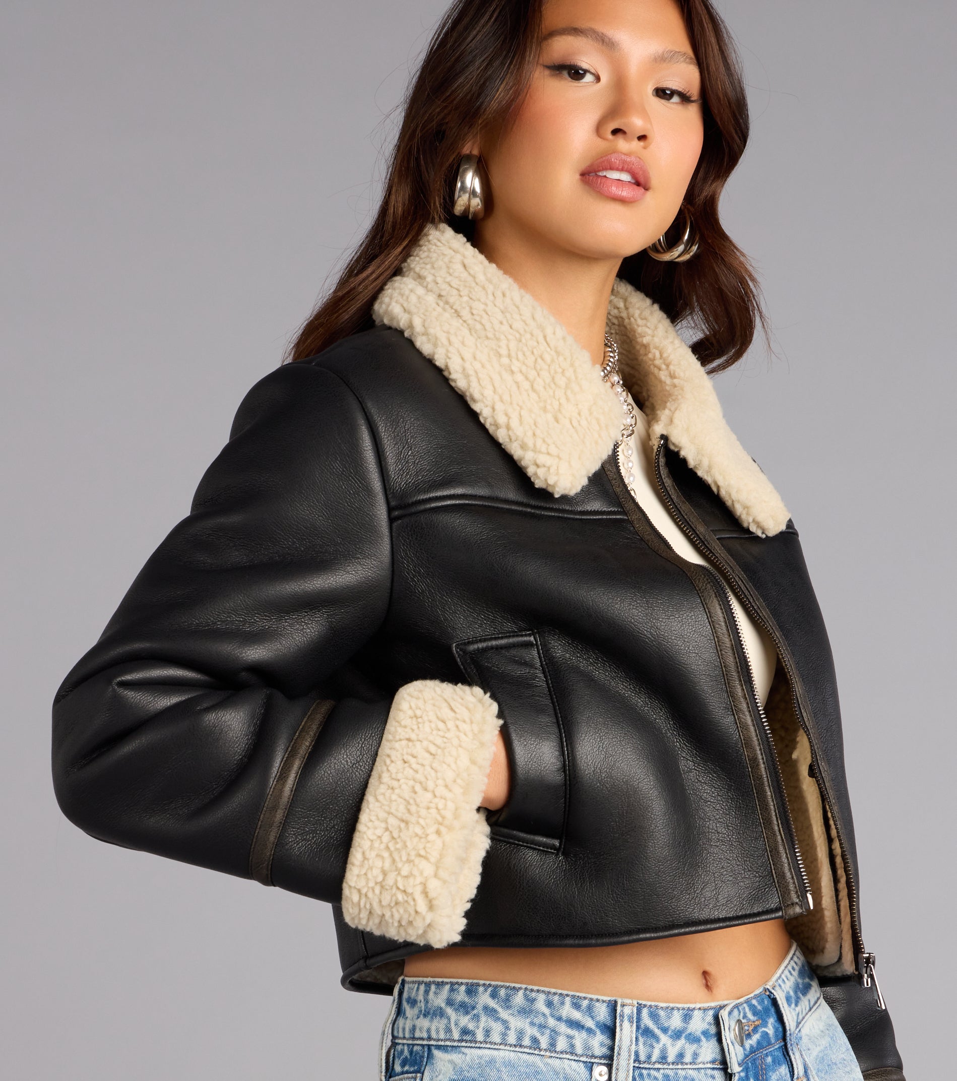This black piece brings trend-right energy to the Downtown Girl Faux Leather Sherpa Crop Jacket, perfect for fall outfits that stand out.