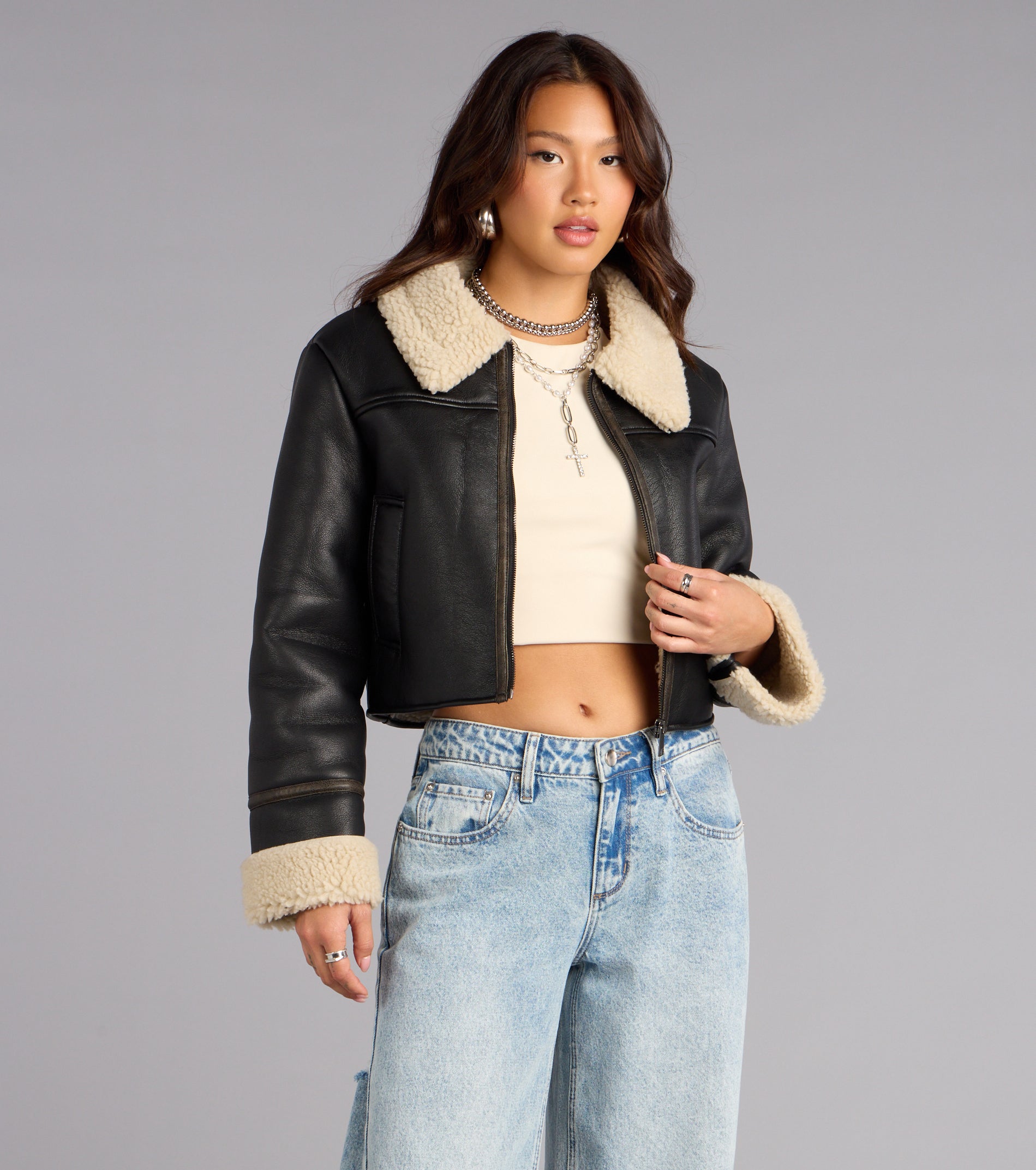 This black piece brings trend-right energy to the Downtown Girl Faux Leather Sherpa Crop Jacket, perfect for fall outfits that stand out.