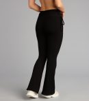 Make a fall statement in e2d25516-c238-4a17-9bbf tones that highlight the Lounge Goals Rib Knit Flare Pants as a must-have among fall bottoms for women.