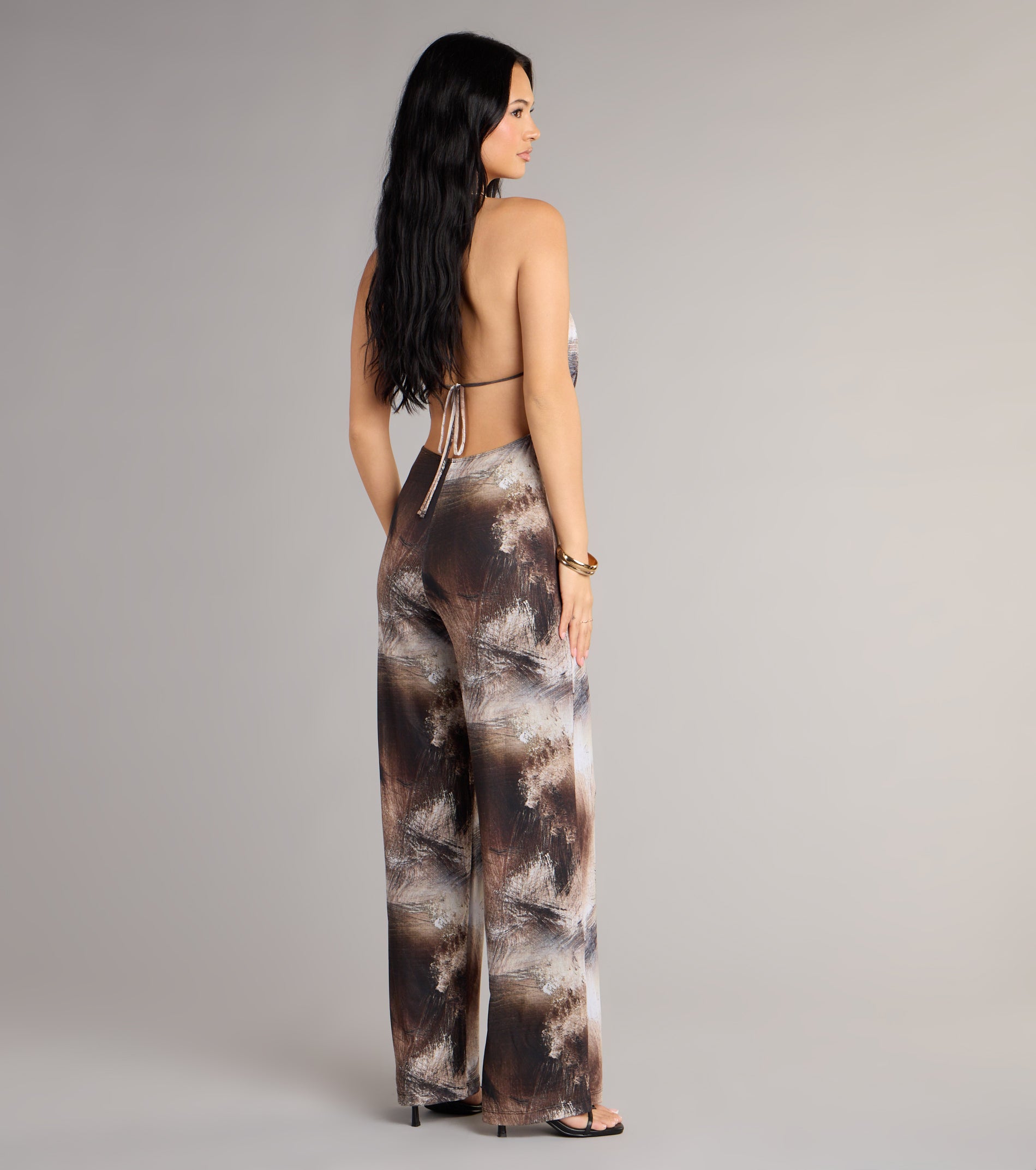 This piece brings trend-right energy to the Abstract Attitude Wide-Leg Jumpsuit, perfect for fall outfits that stand out.