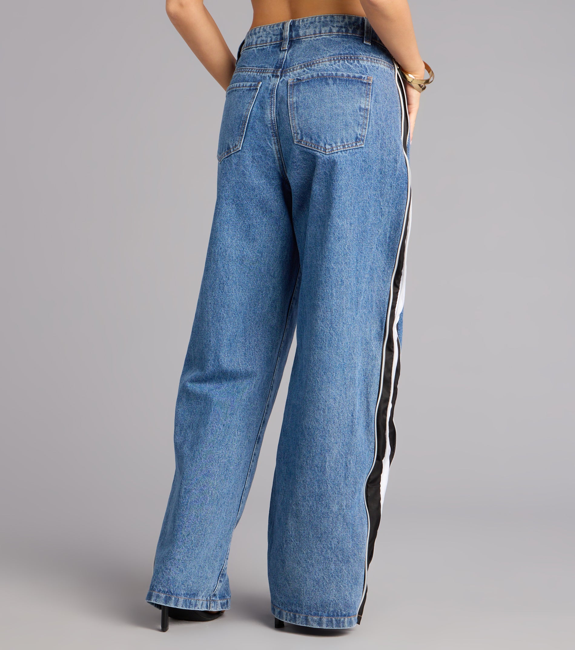 This medium denim wash piece brings trend-right energy to the Street Circuit High-Rise Wide Leg Denim Jeans, perfect for fall outfits that stand out.